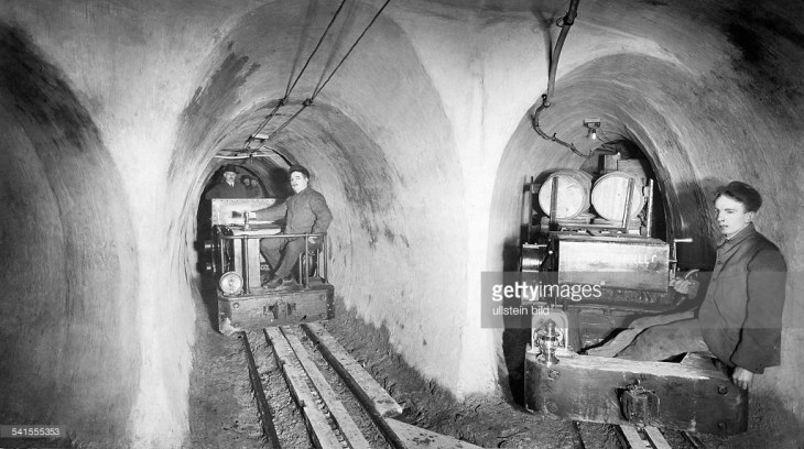 underground-tunnel-workers-on-rail-cars